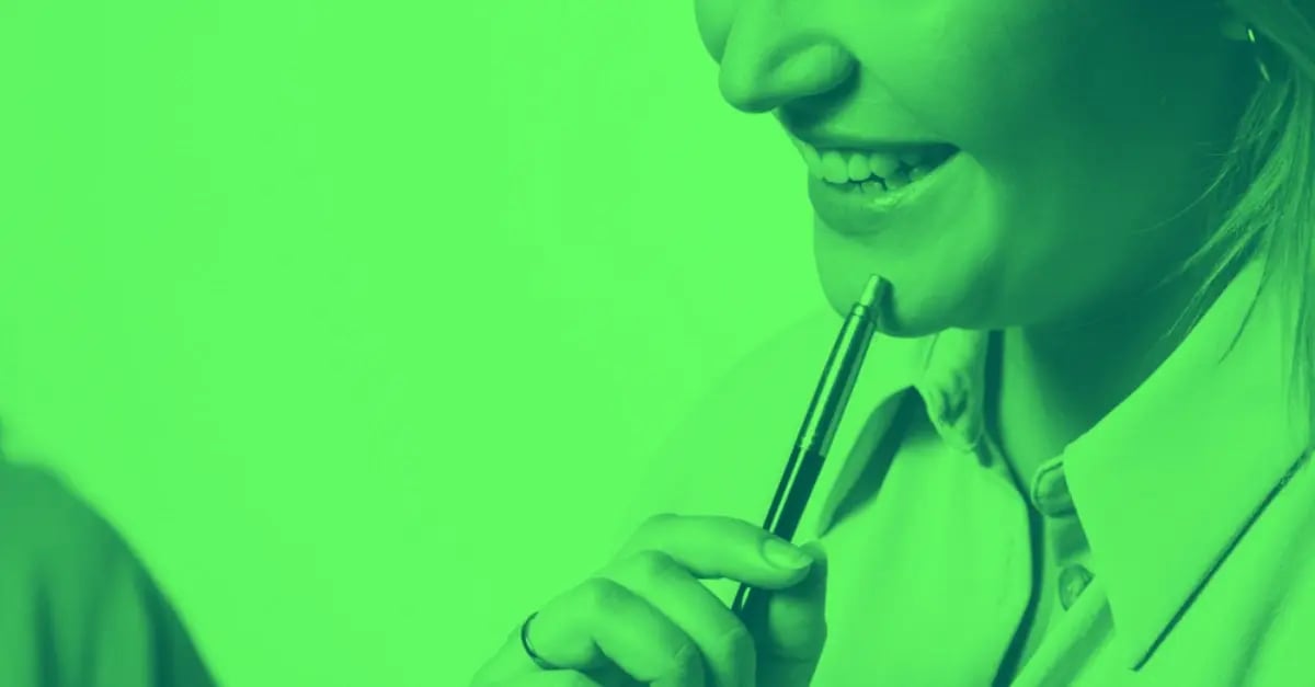 A competent woman holding a pen