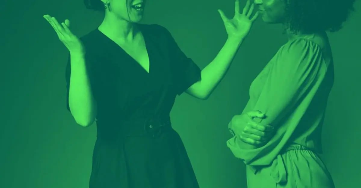 A woman giving another woman feedback